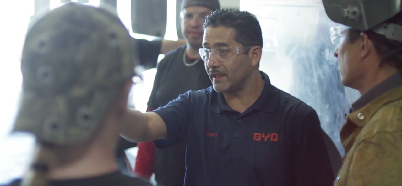 BYD Lancaster factory workers in discussion on the shop floor